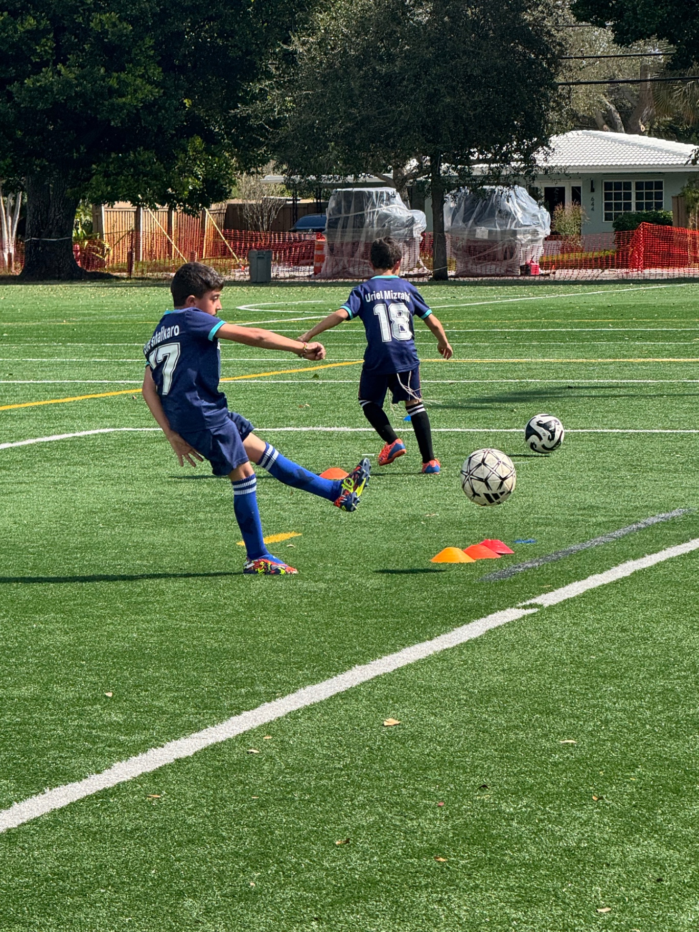 Maccabi South Florida players passing the ball during youth soccer training