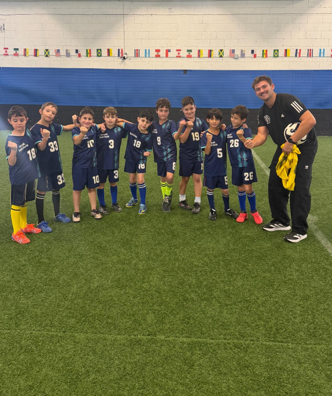Youth soccer Hollywood Florida — coach with kids at Maccabi practice